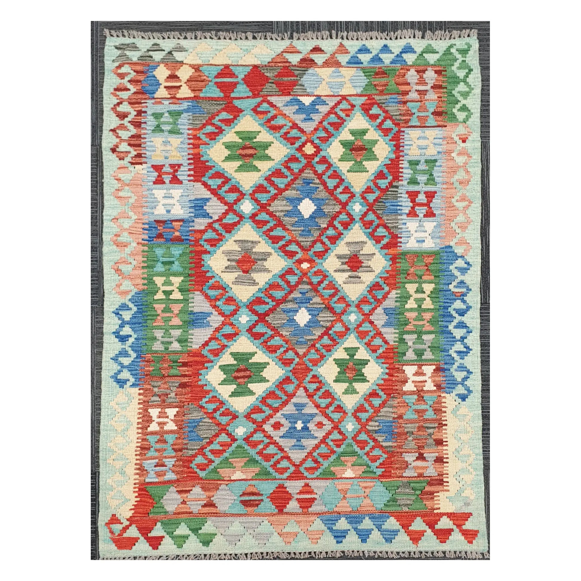 Full view of Afghan Chobi Kilim rug with coral lattice medallion field on an ivory ground, 156 x 106 cm