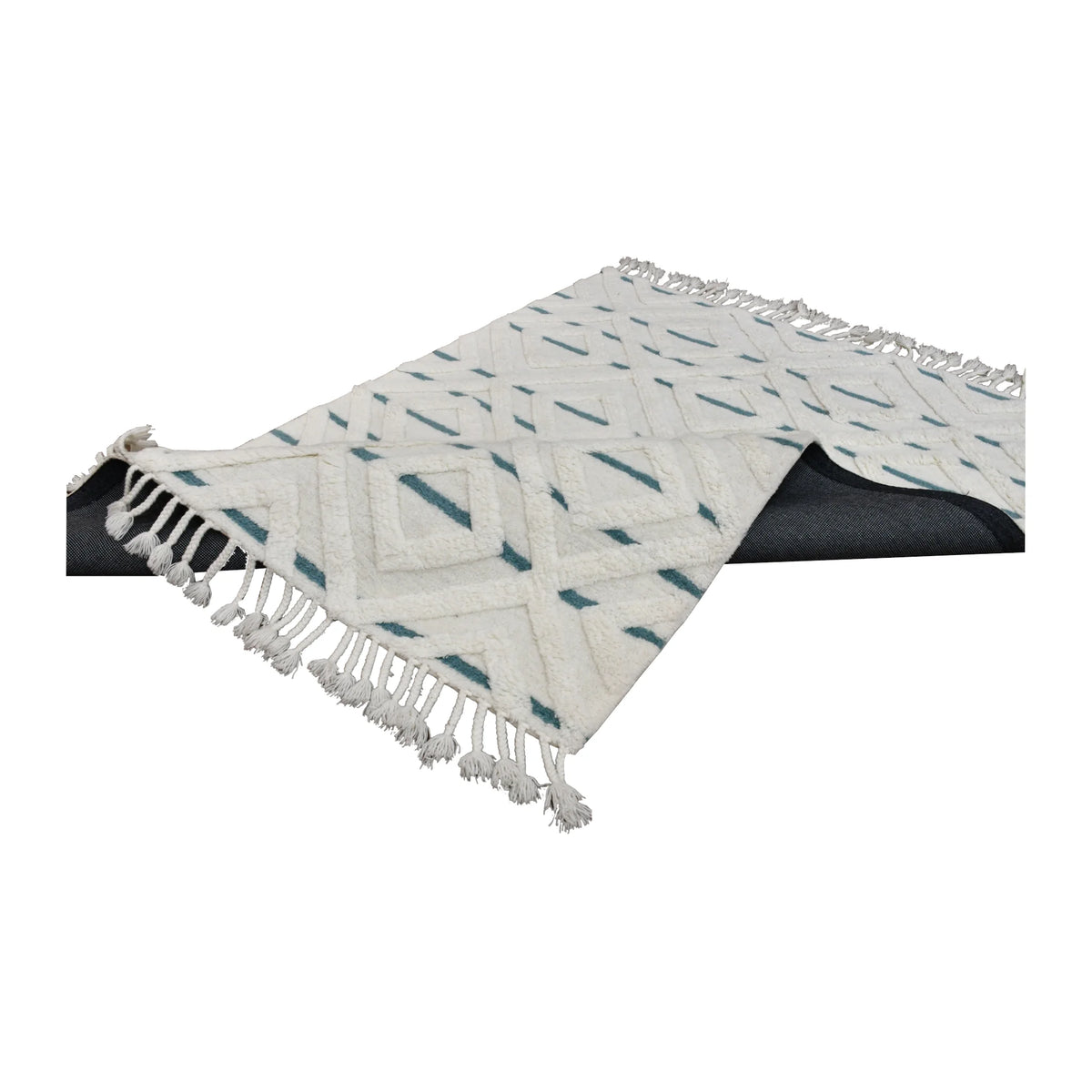 Folded view of cream and blue hand-tufted wool rug showing its thick sculpted pile and tasselled ends