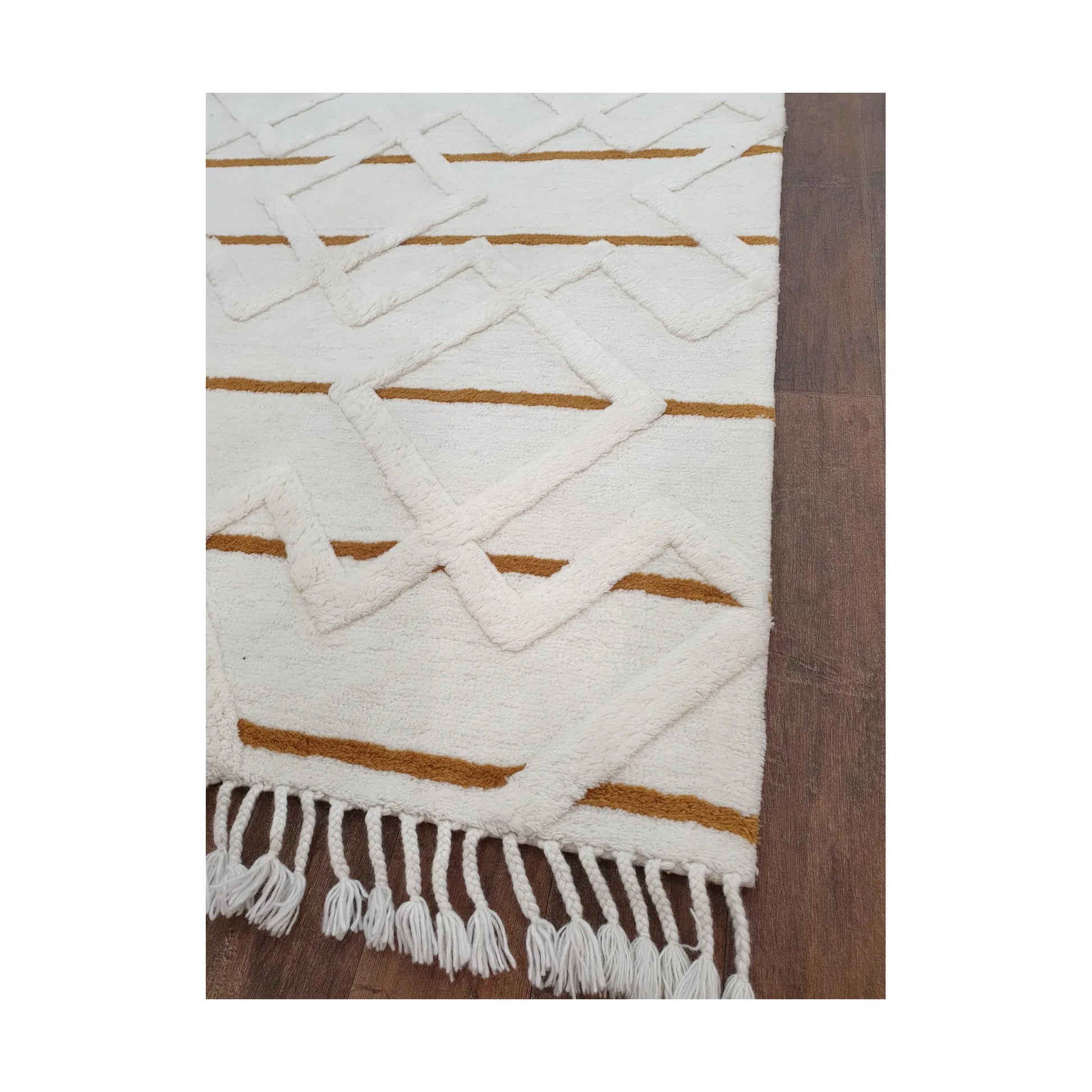 Close-up of cream mustard wool rug showing geometric pattern detail