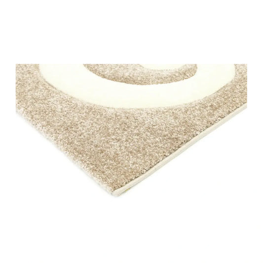 Corner detail of Diamond beige swirl rug showing raised ivory pattern and beige pile