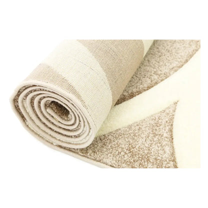 Rolled view of Diamond beige swirl rug showing surface pattern and backing