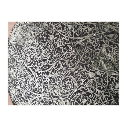 Close-up of Brooklyn round rug with emerald, charcoal, and silver botanical scroll design, 160 cm