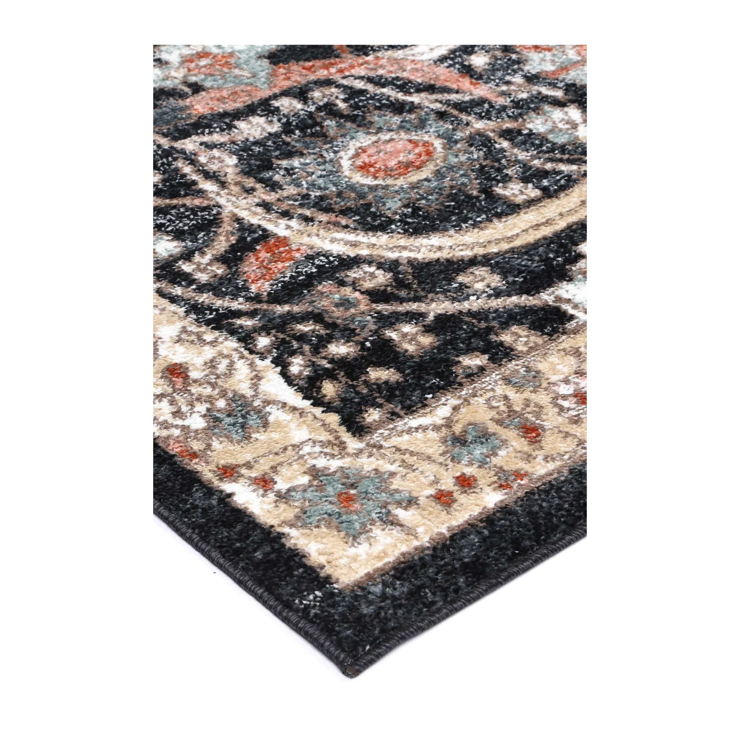 Angled corner detail of Estate Charcoal rug showing the bound edge, ivory floral border and charcoal polypropylene pile