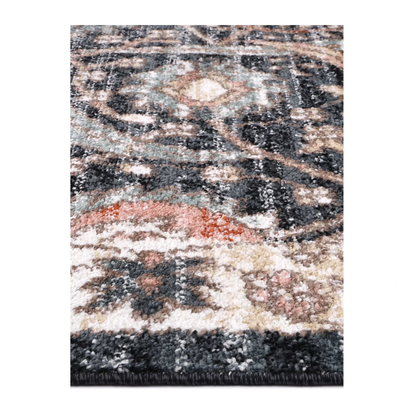 Close-up of Estate Charcoal rug showing charcoal polypropylene pile with ivory, grey and muted rust floral details