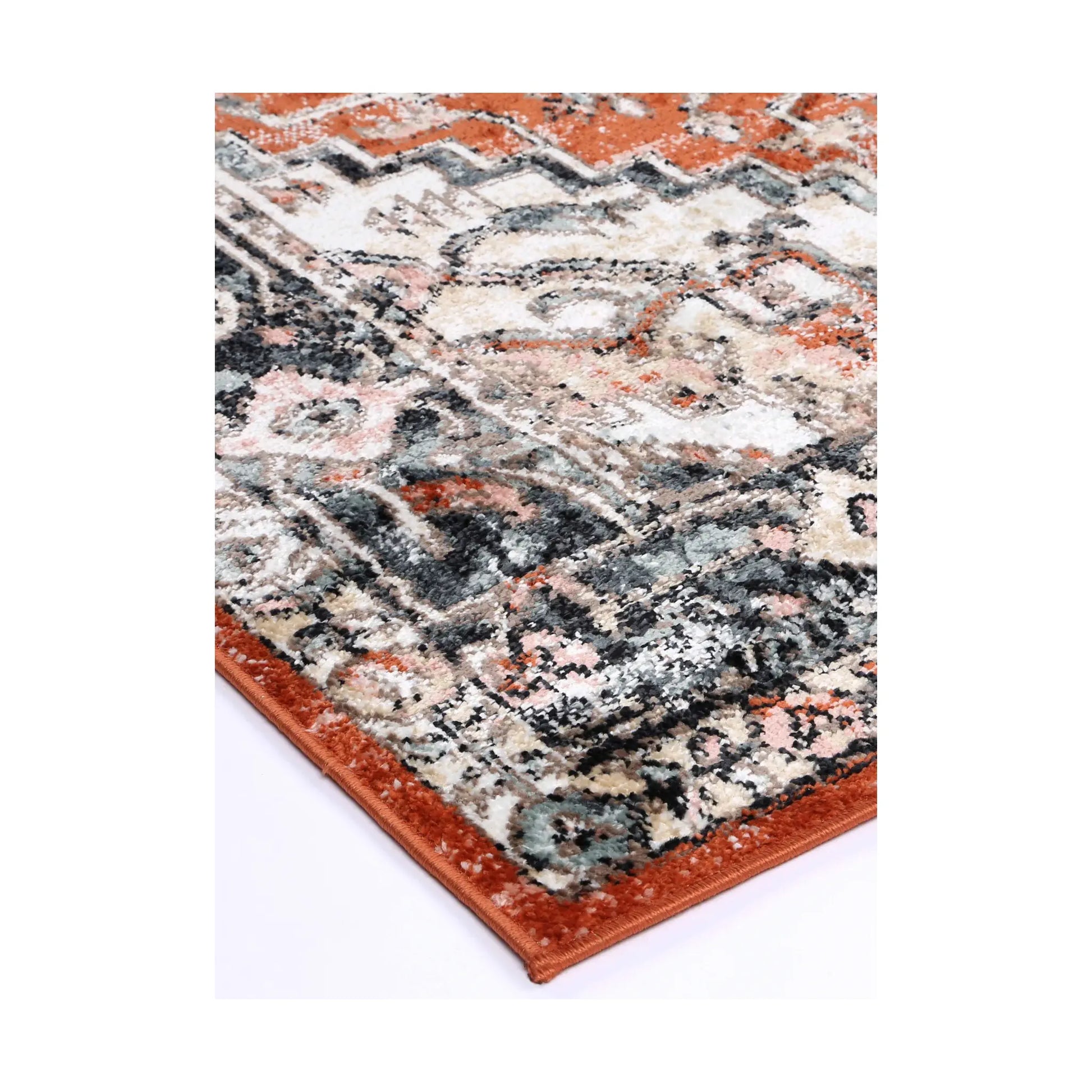 Corner detail of Estate Terracotta transitional rug showing bound edge, ornamental border and textured pile, 290 x 200 cm