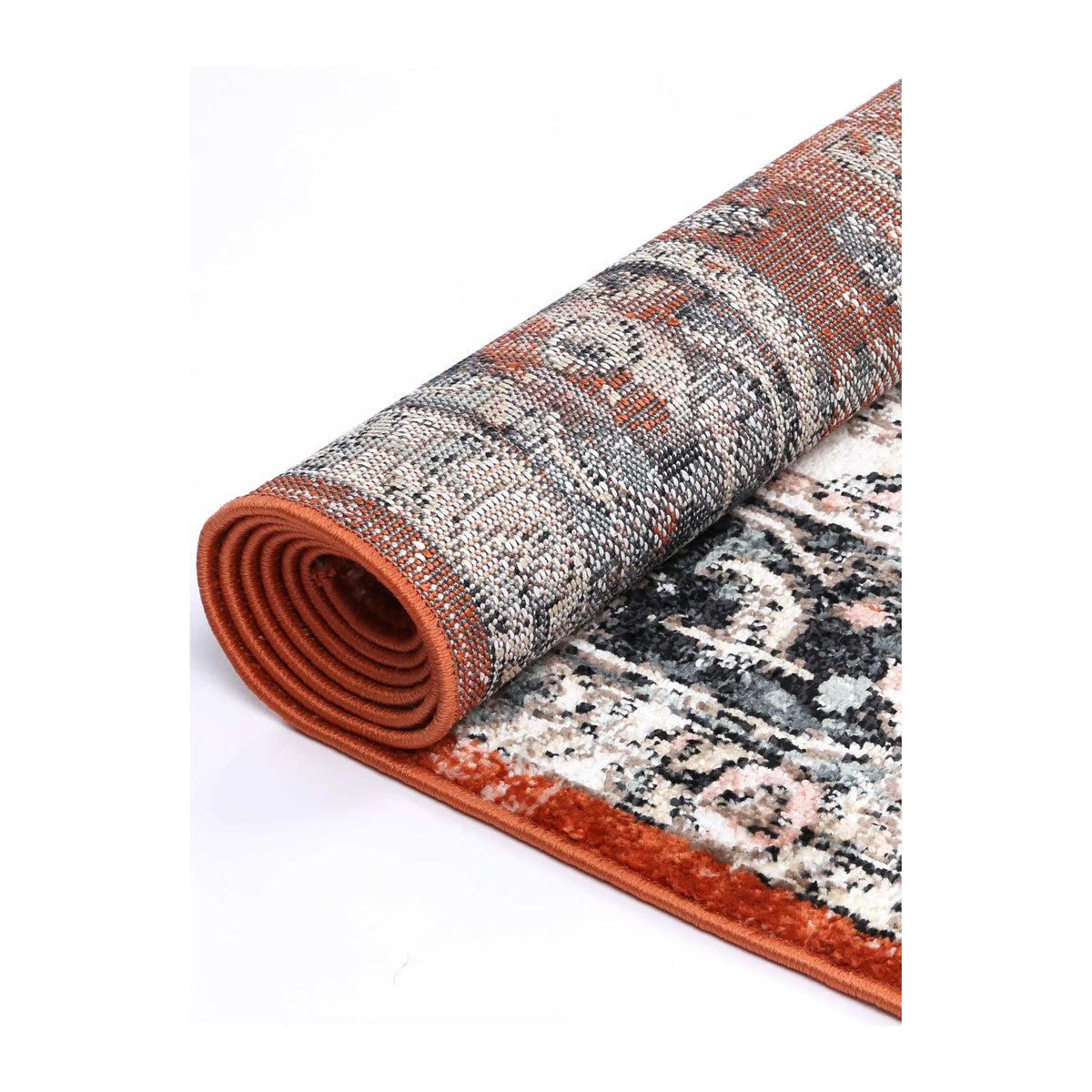 Rolled Estate Terracotta rug showing the woven backing, bound edge and terracotta, ivory and charcoal pattern