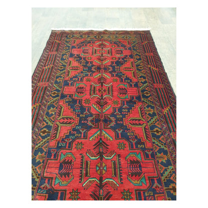 Field motif detail of Afghan Baluchi rug with red and dark blue tribal pattern