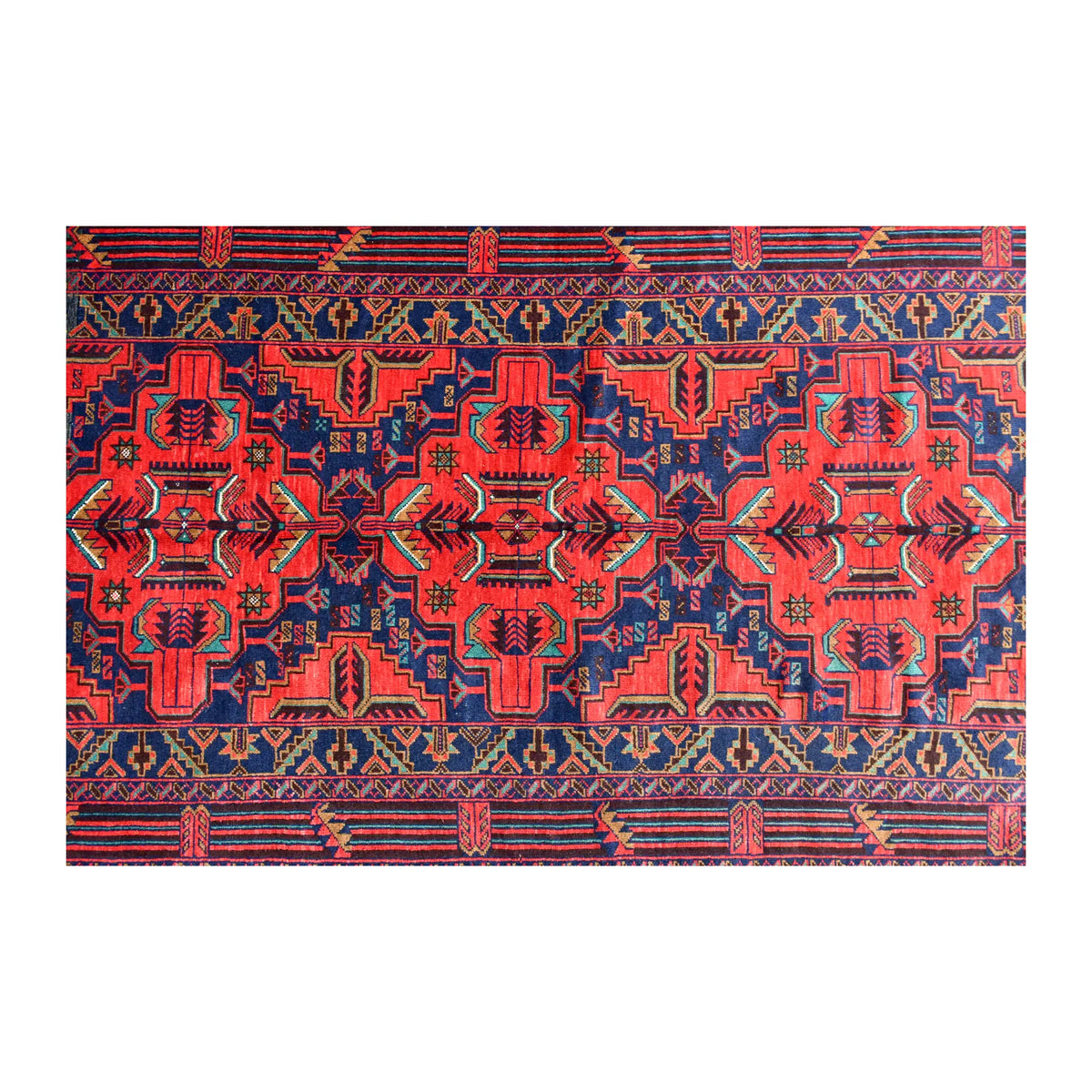 Field detail of Afghan Baluchi rug showing mirror-balanced floral-geometric motifs in red and dark navy