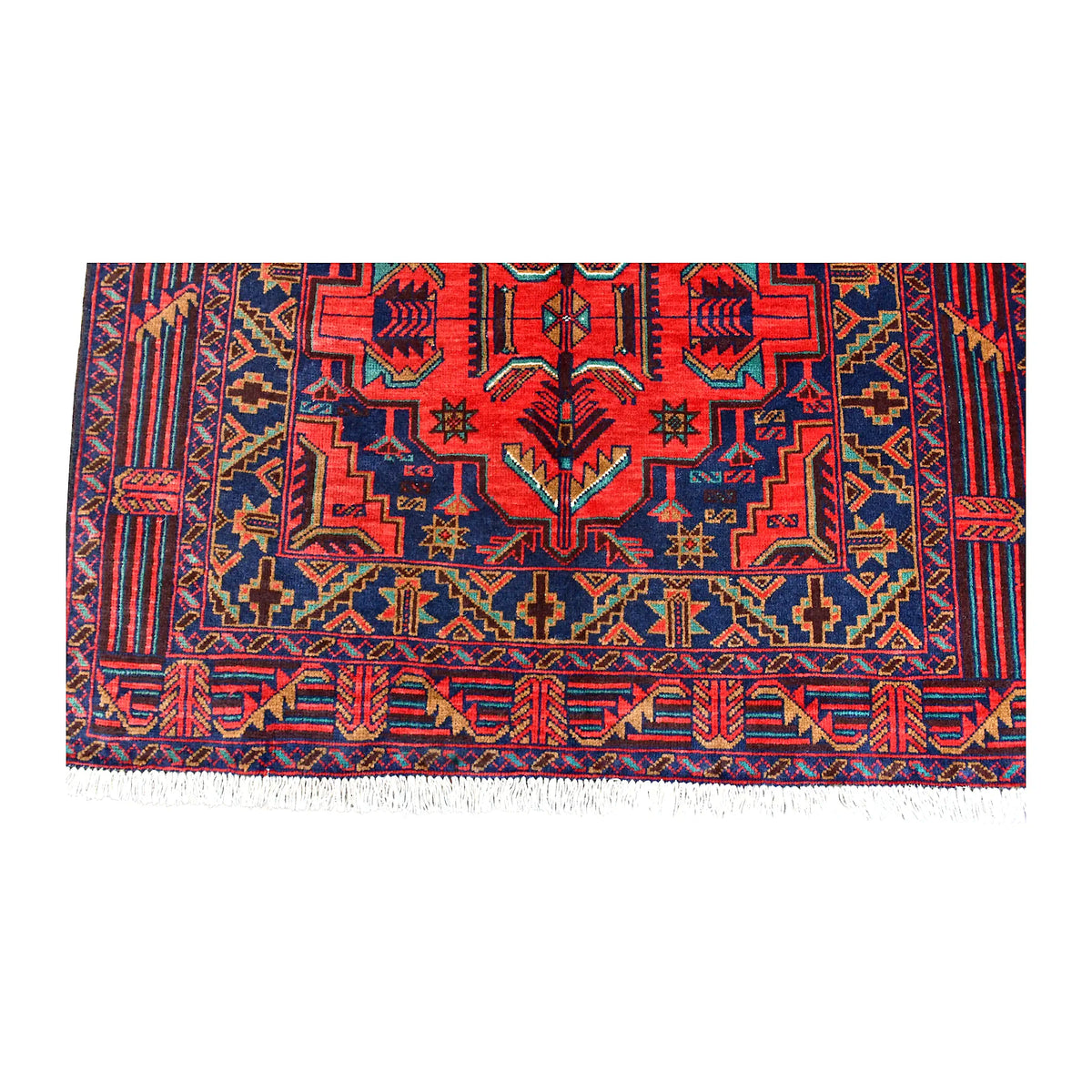 Fringe and end-border detail of Baluchi rug with angular red, dark navy, teal and ochre motifs