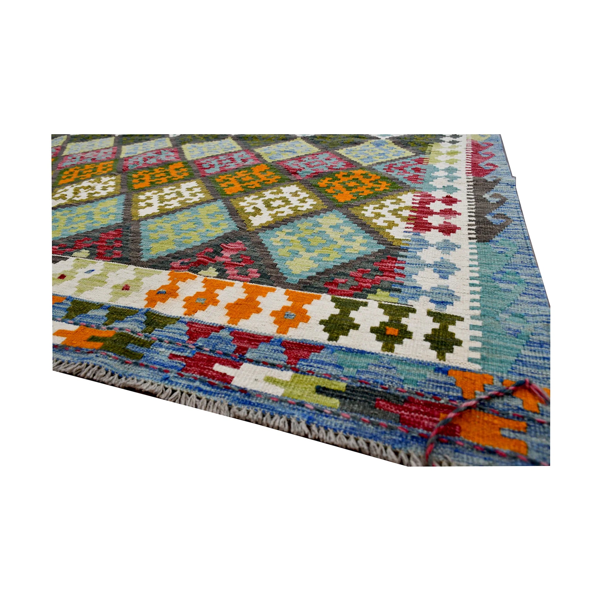 Angled edge detail of Fine Afghan Chobi Kilim rug showing fringe, flatwoven texture and colourful border