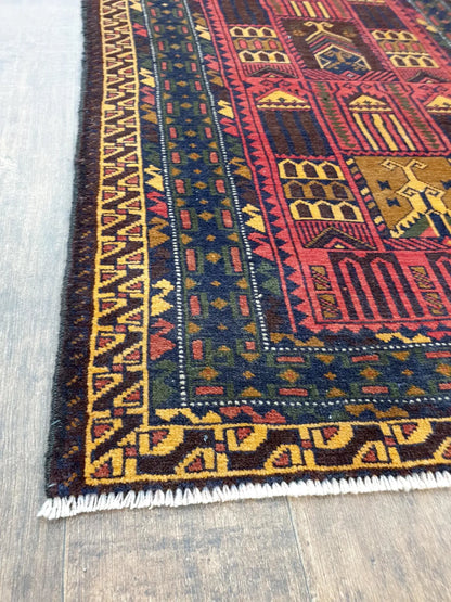 Fine Baluchi hand-knotted wool rug border detail