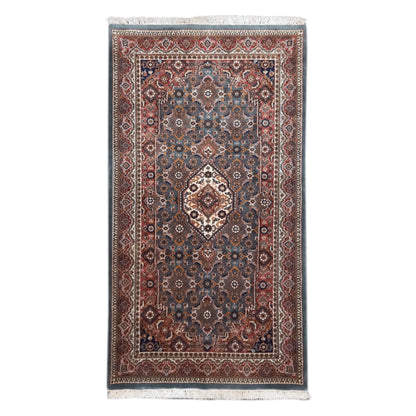 Full view of Fine Bidjar hand-knotted wool rug with central diamond medallion, dense floral field and layered rust-toned borders, 162 x 92 cm
