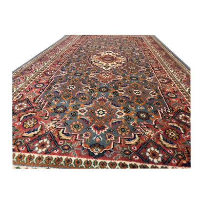 Close-up of Fine Bidjar rug showing the central medallion, dense floral motifs and lower border detail