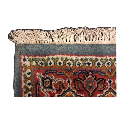 Close-up of Fine Bidjar rug showing the patterned end border and visible fringe