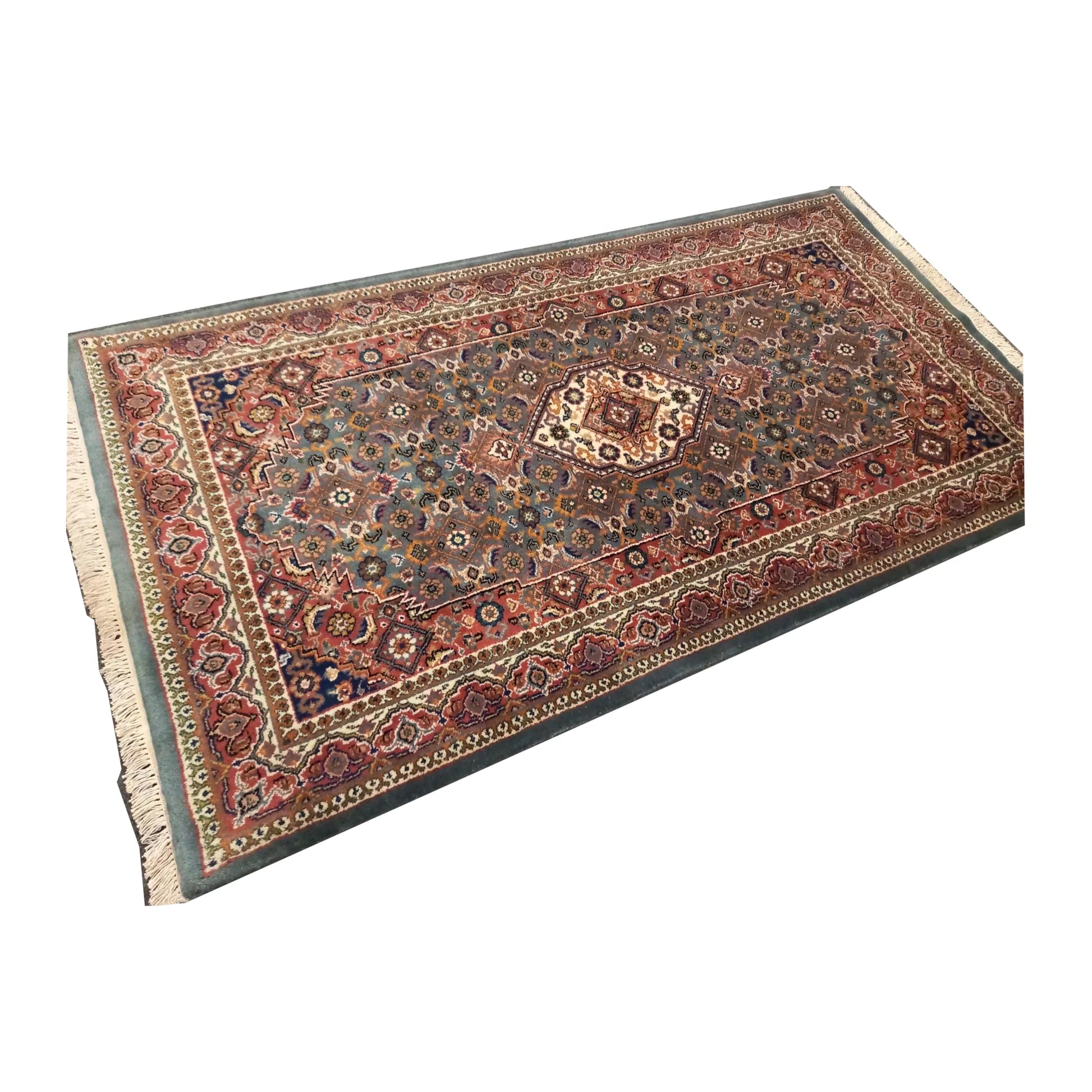 Showroom angled full view of Fine Bidjar wool rug showing the floral field, central medallion and layered borders
