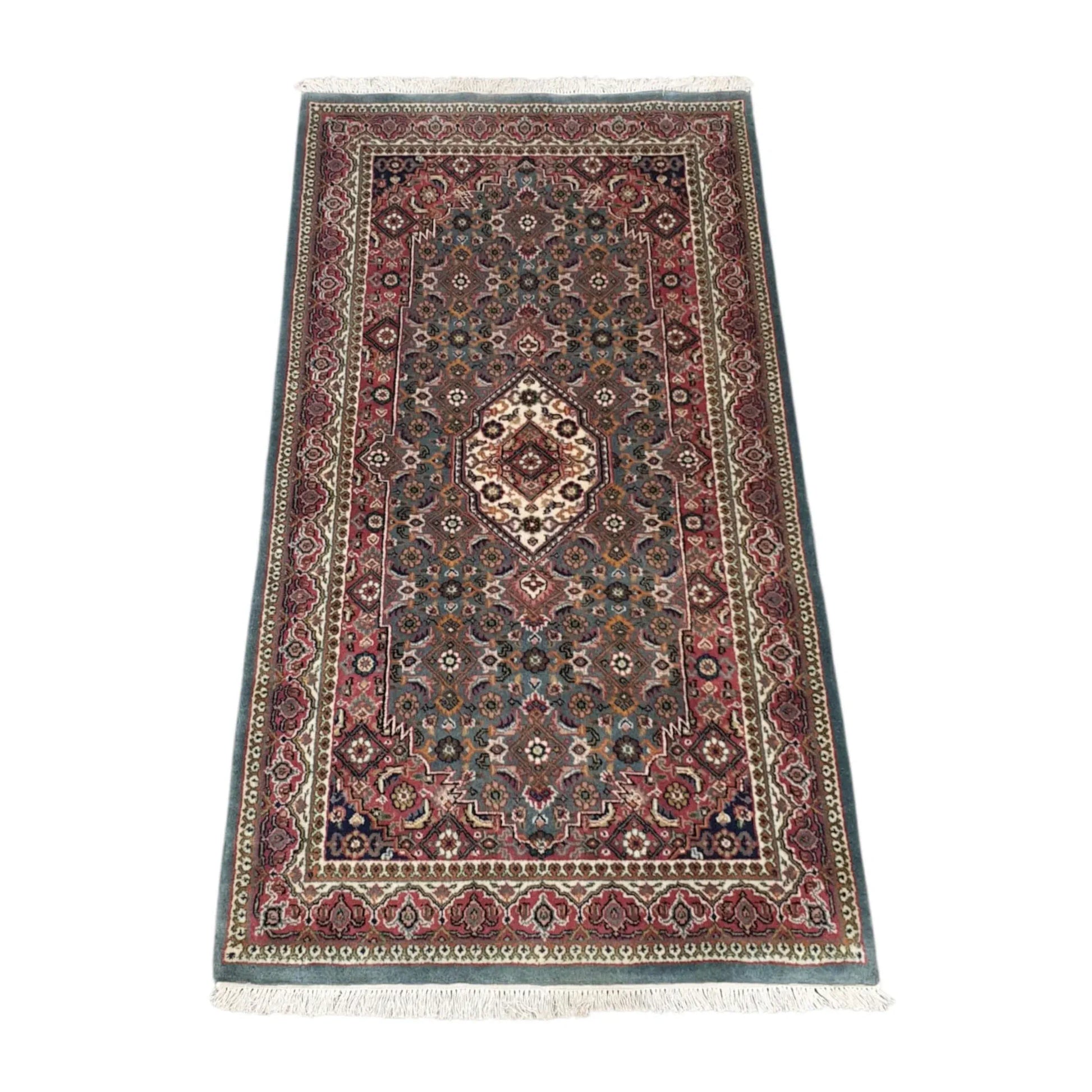 Angled full view of Fine Bidjar wool rug showing the central medallion, floral field and patterned borders