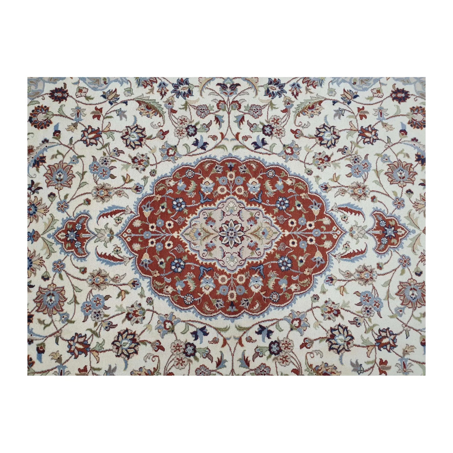 Detail of Fine Tabriz rug showing the central red medallion surrounded by beige and blue floral motifs