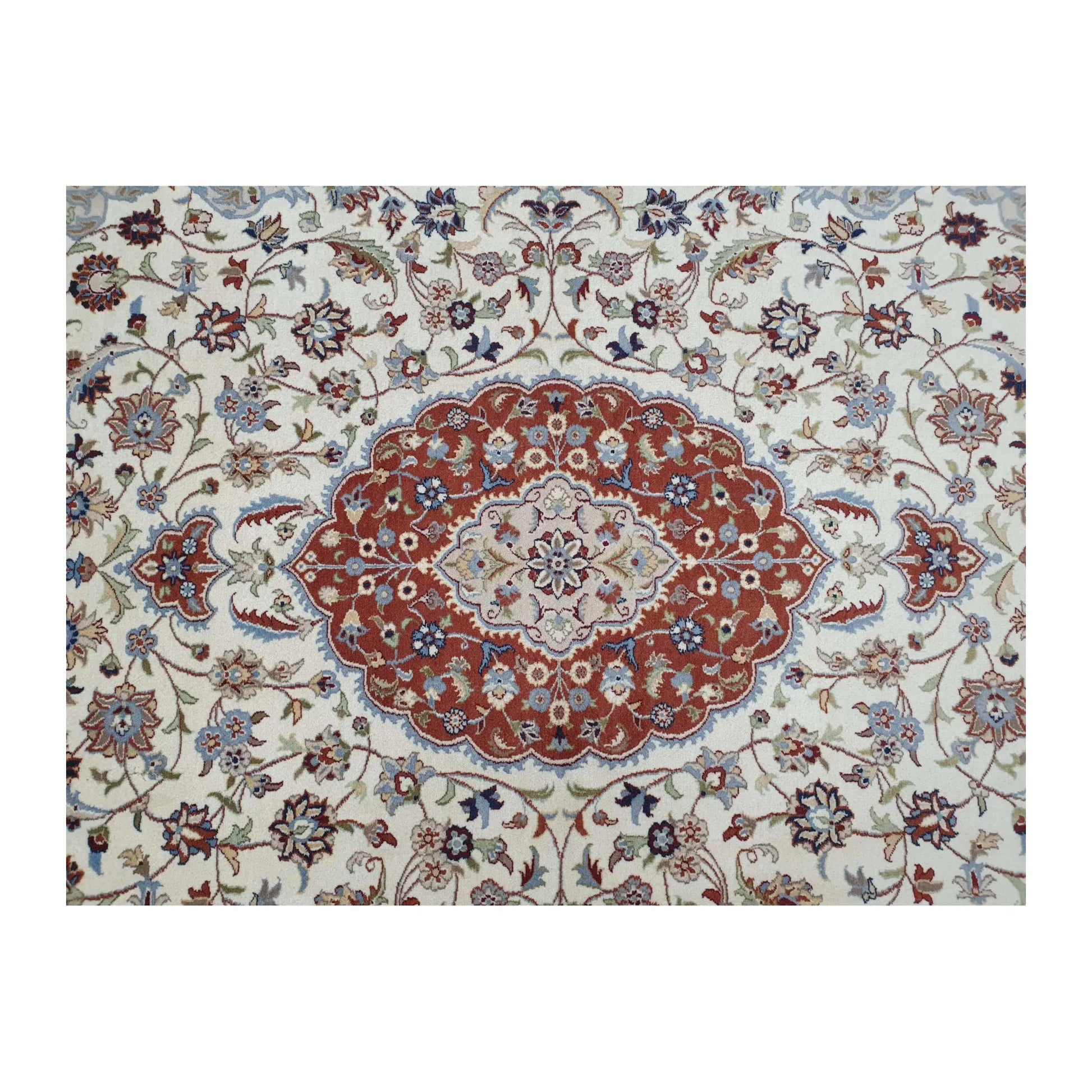 Detail of Fine Tabriz rug showing the central red medallion surrounded by beige and blue floral motifs