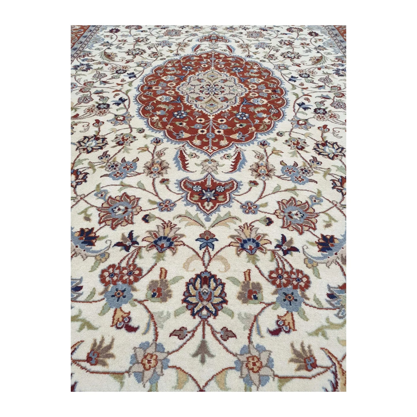 Close-up of Fine Tabriz rug showing the medallion pendant and detailed floral vine pattern