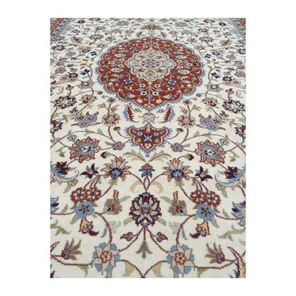 Close-up of Fine Tabriz rug showing the medallion pendant and detailed floral vine pattern