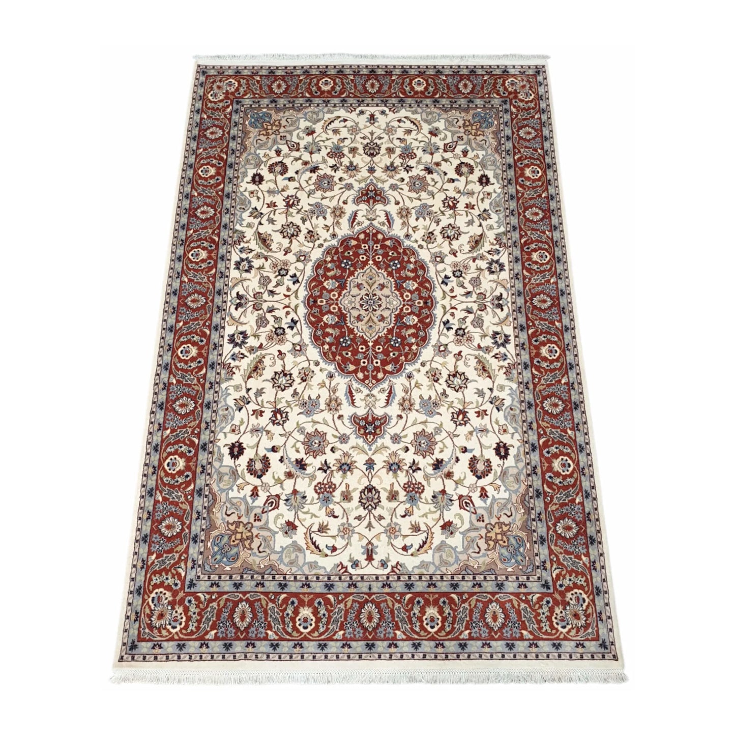 Angled full view of Fine Tabriz wool rug showing the beige floral field, red medallion and patterned border