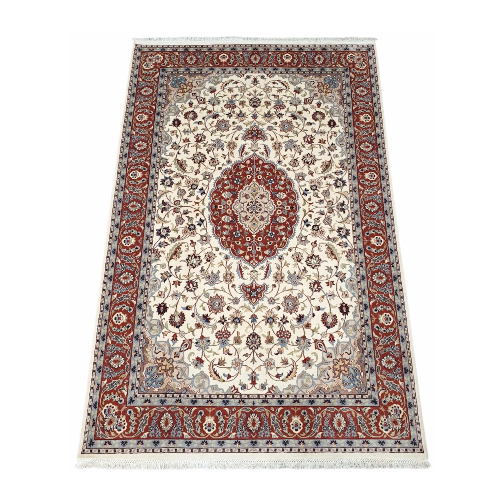 Angled full view of Fine Tabriz wool rug showing the beige floral field, red medallion and patterned border