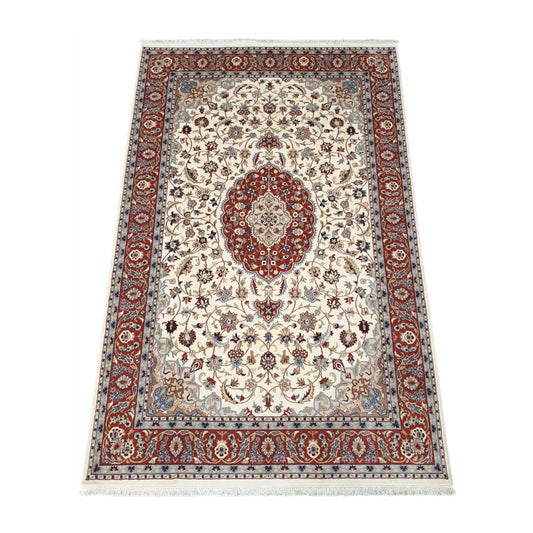 Angled full view of Fine Tabriz wool rug showing the beige floral field, red medallion and patterned border