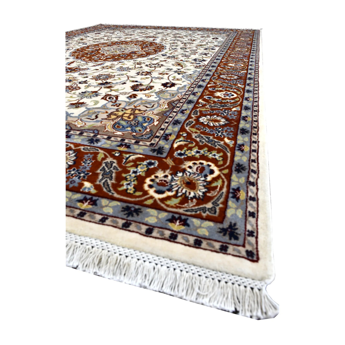 Angled view of Fine Tabriz rug showing its pale vine-patterned field, rust-red floral border and white fringe