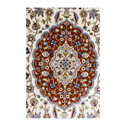 Close-up of the Fine Tabriz rug’s ornate rust-red medallion with a pale floral centre and blue accents