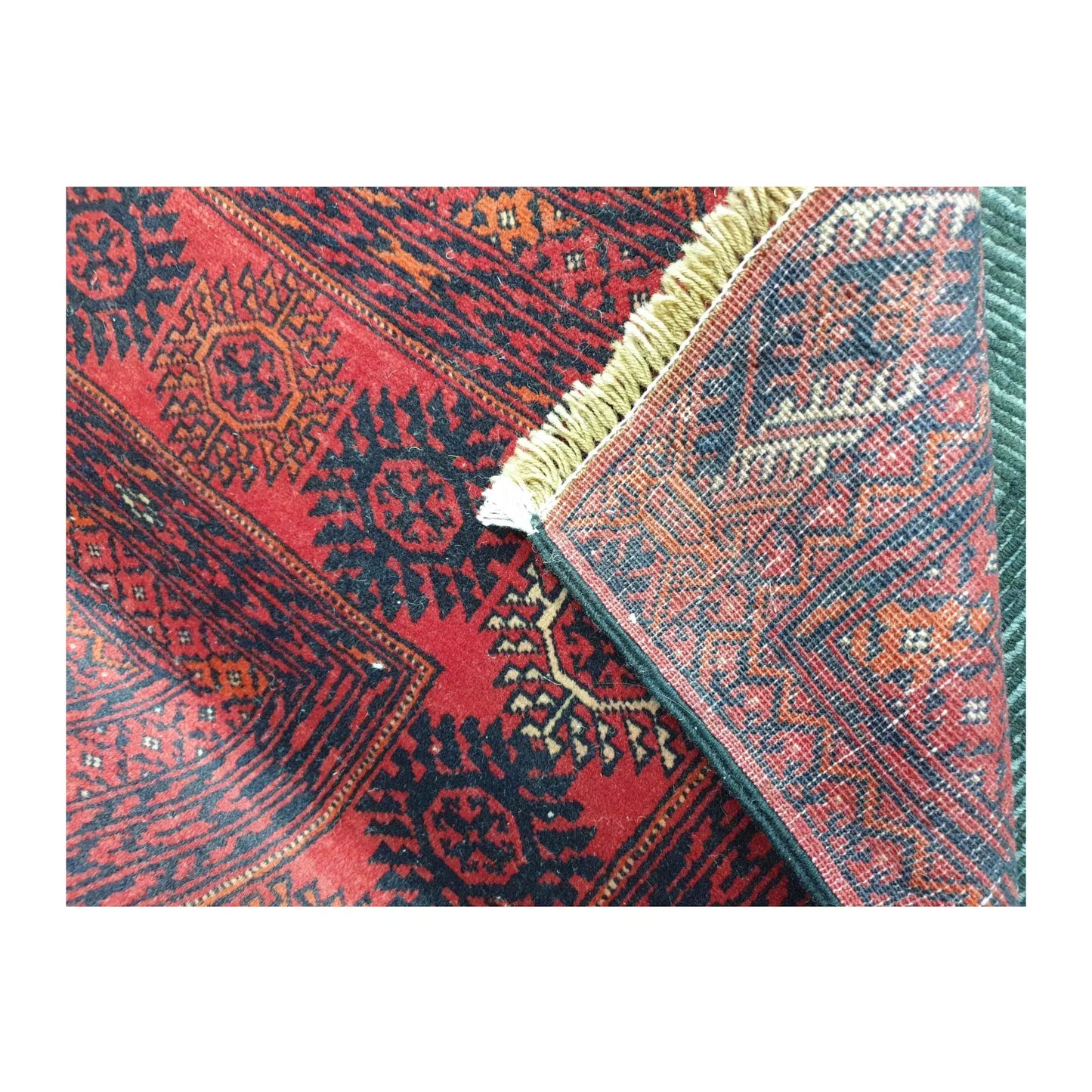 Folded reverse-weave detail of Fine Turkmen Tekke wool rug with fringe, 286 x 196 cm