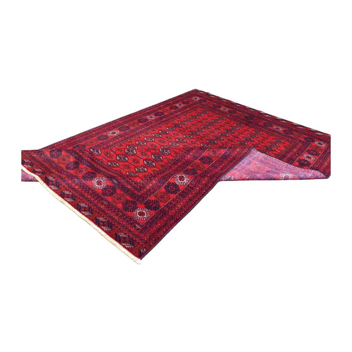 Folded view of the Fine Turkmen Tekke rug showing its red patterned front and exposed reverse