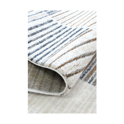 Folded edge detail of Grace GRAC003 Blue Grey rug showing polyester pile, backing and woven edge finish, 230 x 160 cm