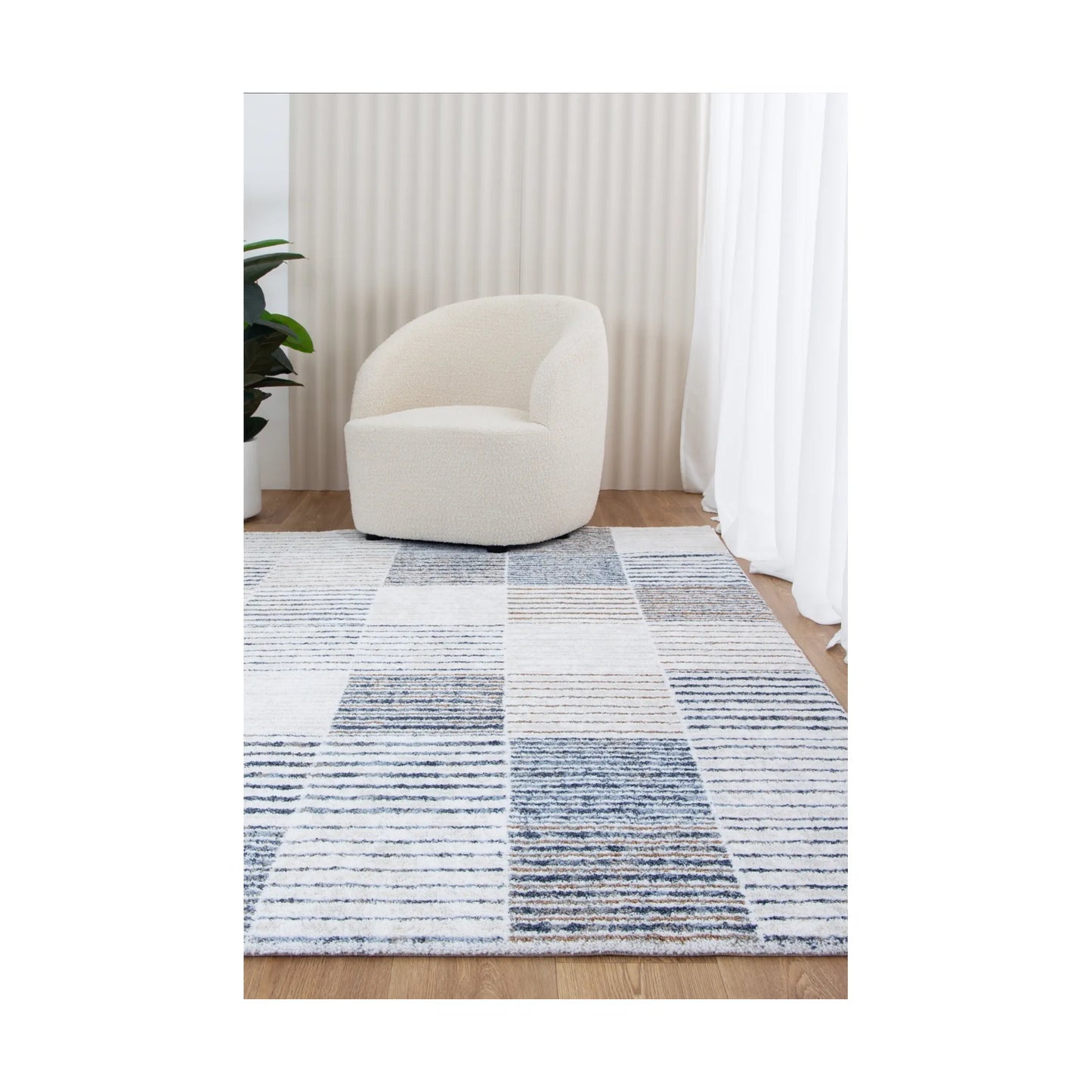 Grace GRAC003 Blue Grey contemporary rug styled with chair and neutral décor, showing soft modern pattern, 230 x 160 cm