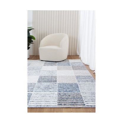 Grace GRAC003 Blue Grey contemporary rug styled with chair and neutral décor, showing soft modern pattern, 230 x 160 cm