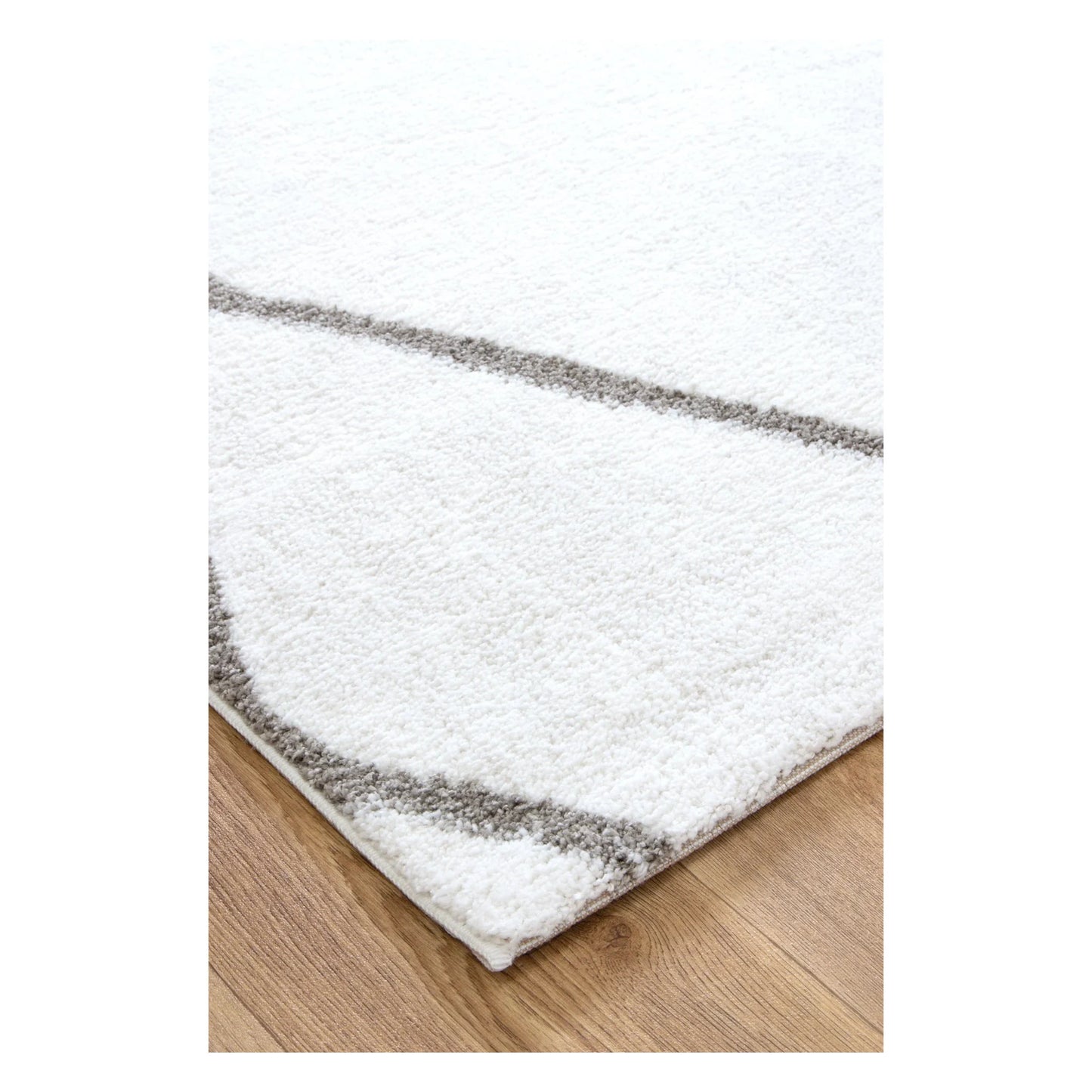 Close-up of Grace trellis rug showing ivory edge, grey pattern and pile detail