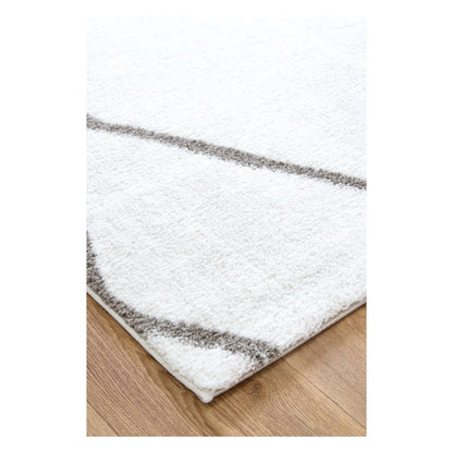 Close-up of Grace trellis rug showing ivory edge, grey pattern and pile detail