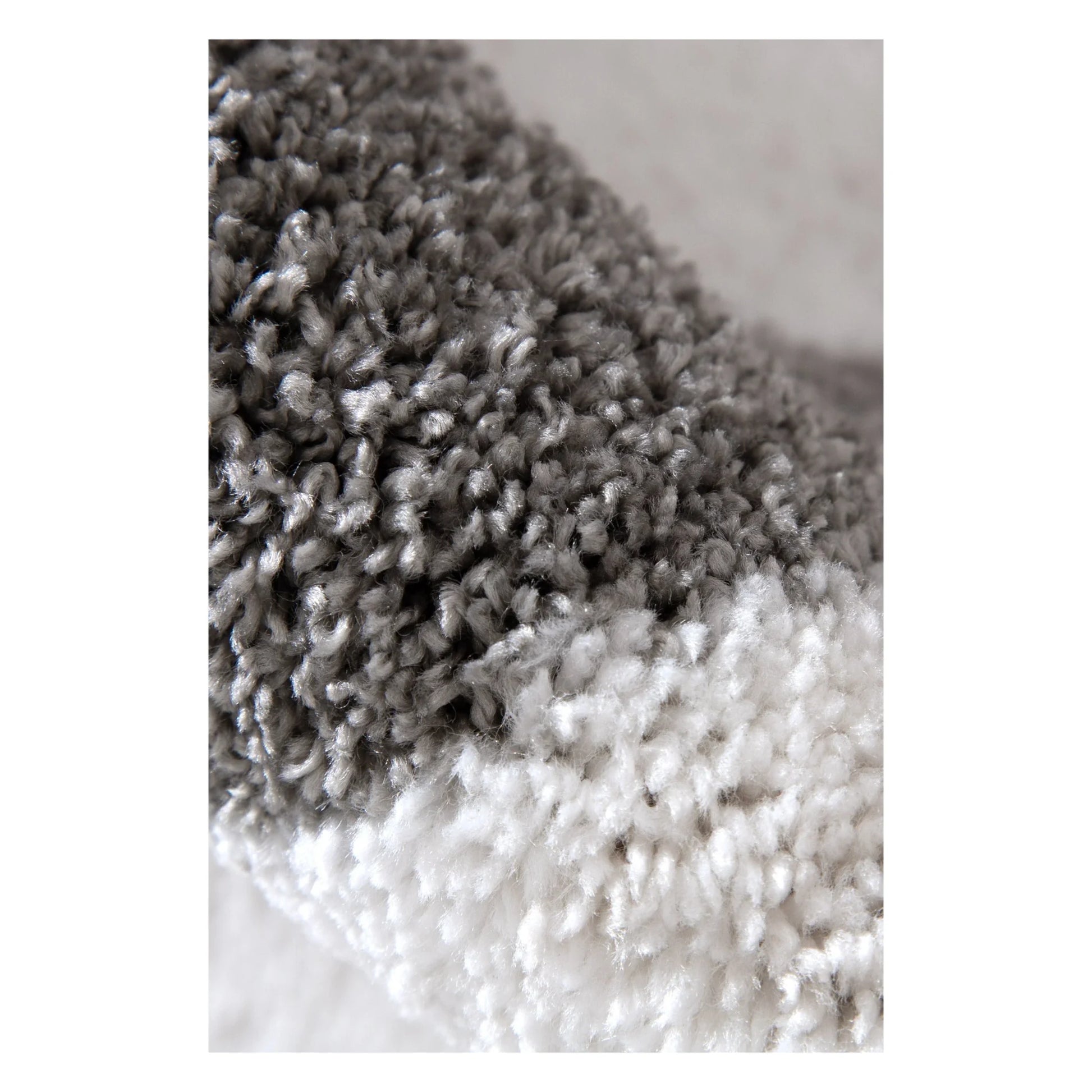Close-up of Grace rug showing grey pile texture and soft polyester fibres