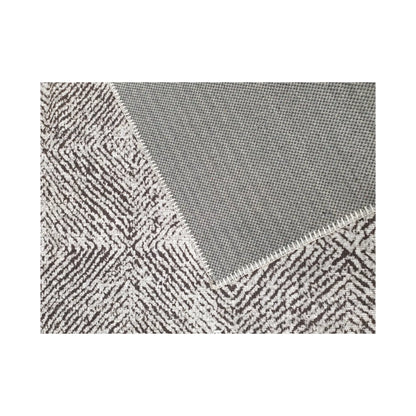 Close-up of grey charcoal cotton rug corner with back and edge detail
