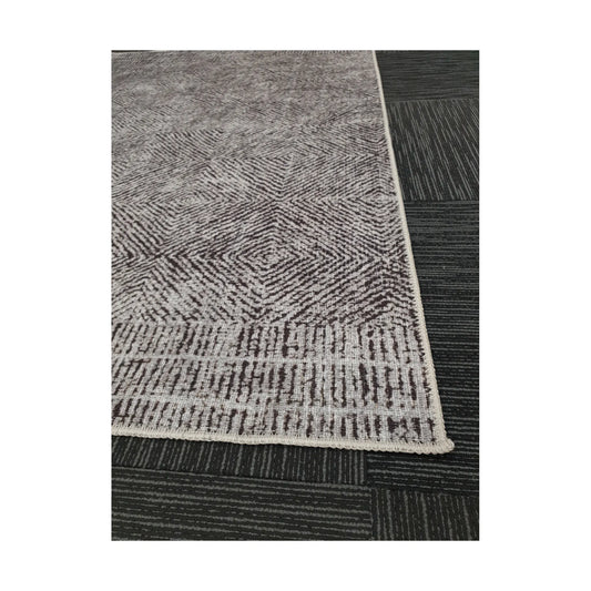 Close-up of grey charcoal chevron cotton rug corner and edge detail