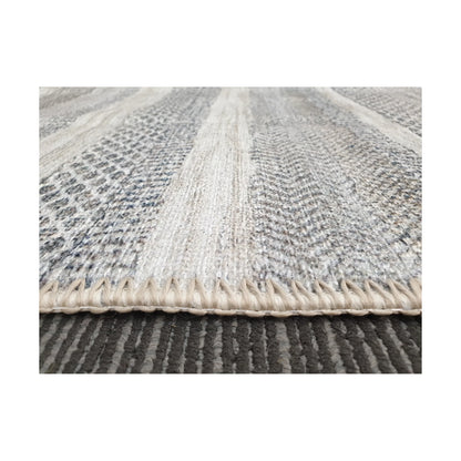 Low-angle close-up of grey ivory cotton rug edge and woven texture