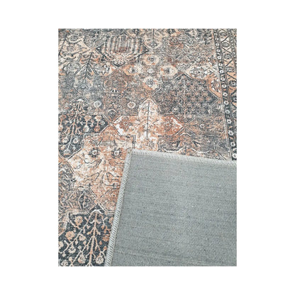 Close-up of grey rust cotton rug corner with back and edge detail