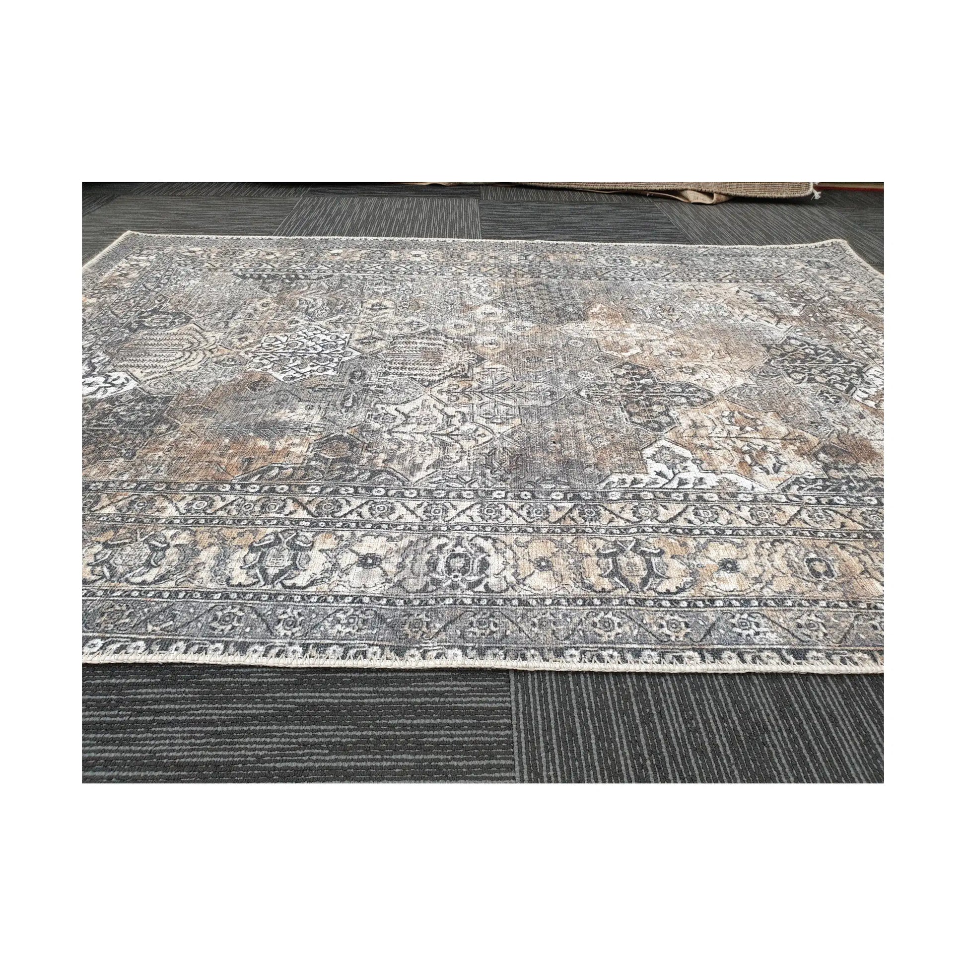 Close-up of grey silver cotton rug border pattern and faded vintage-style detail