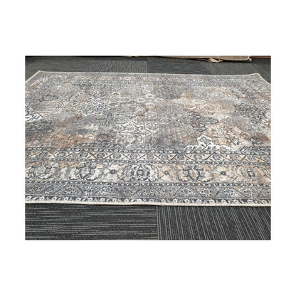 Close-up of grey silver cotton rug border pattern and faded vintage-style detail