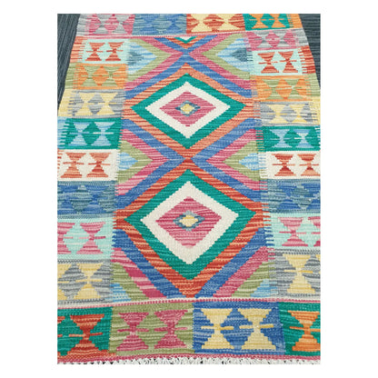 Close-up of Chobi Kilim rug with stacked diamond motifs in teal, coral, jade green, mustard, and powder blue, 109 x 80 cm