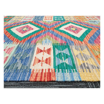 Low-angle close-up of Afghan Chobi Kilim showing wool flatweave texture and multicolour geometric pattern, 109 x 80 cm