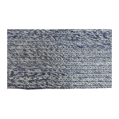Edge and pile detail of Harlow wool rug showing its marled blue-grey texture and neatly finished profile