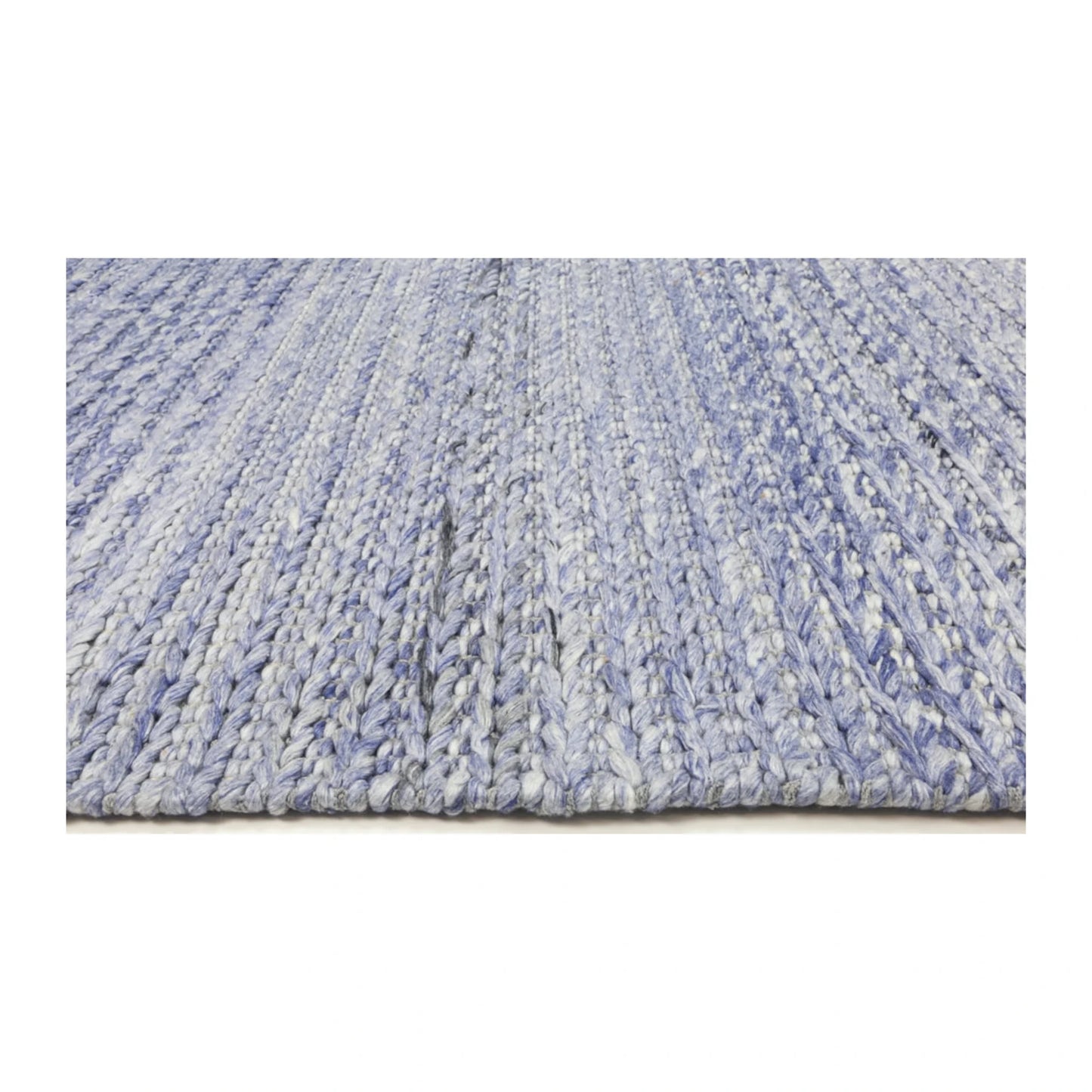 Low-angle edge detail of Harlow blue hand-tufted wool rug