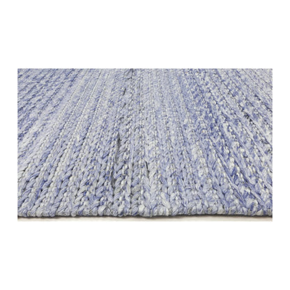Low-angle edge detail of Harlow blue hand-tufted wool rug