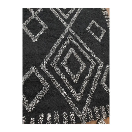 Pattern detail of Indian cotton black diamond rug showing ivory diamond motifs