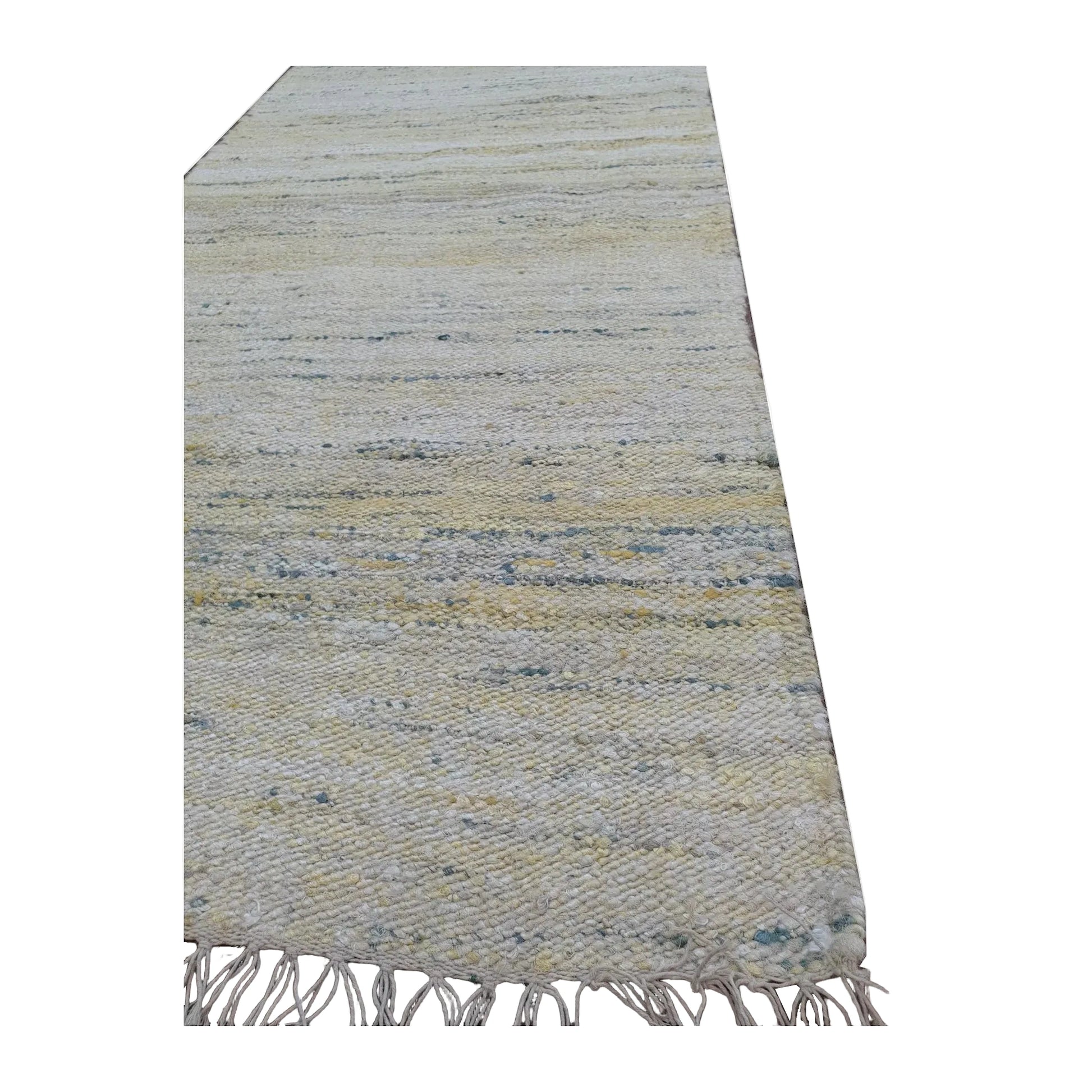 Angled fringe detail of Indian Dhurrie runner showing woven flatweave texture and softly blended stripe colours